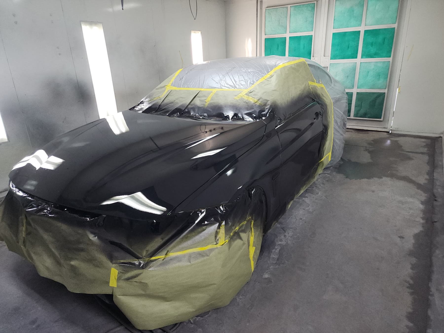Black BMW 430i front end during refinishing work